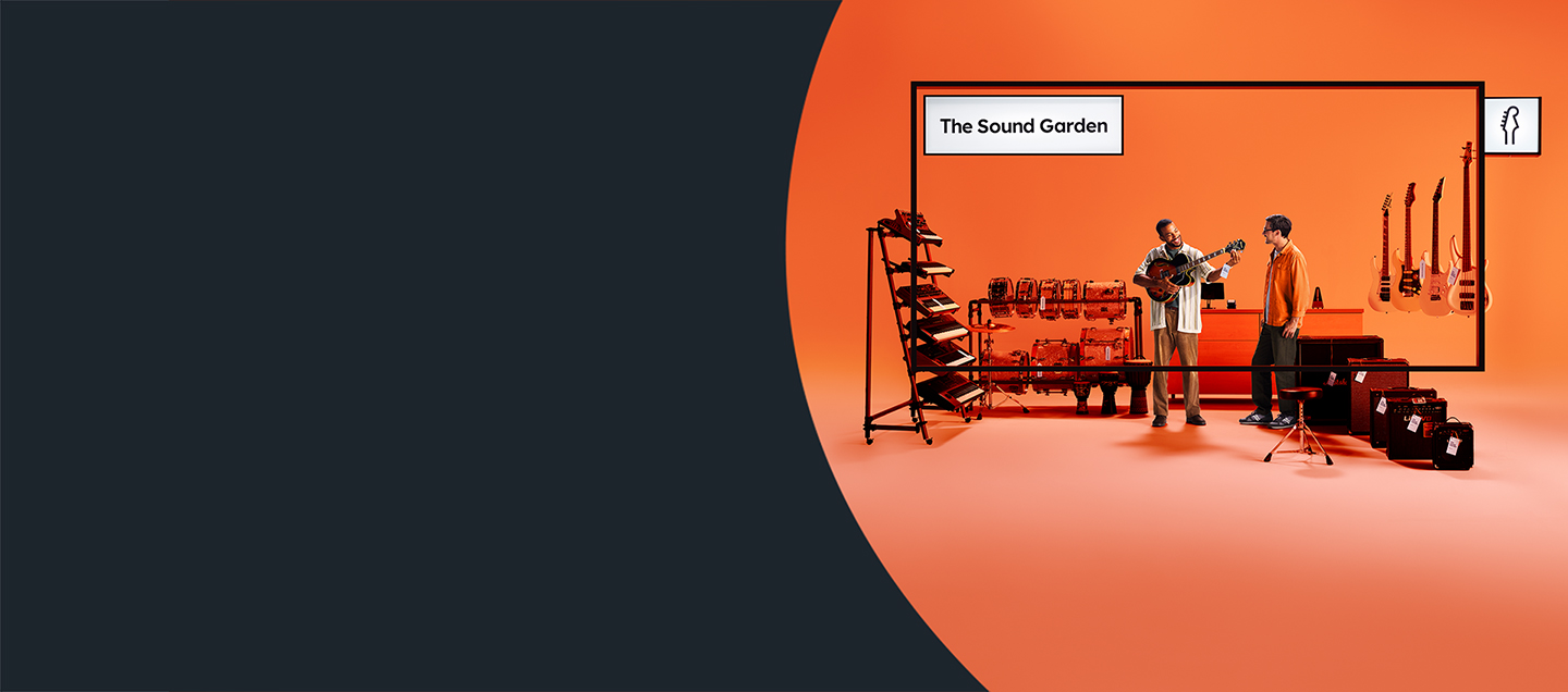 A man playing guitar in a music shop called The Sound garden