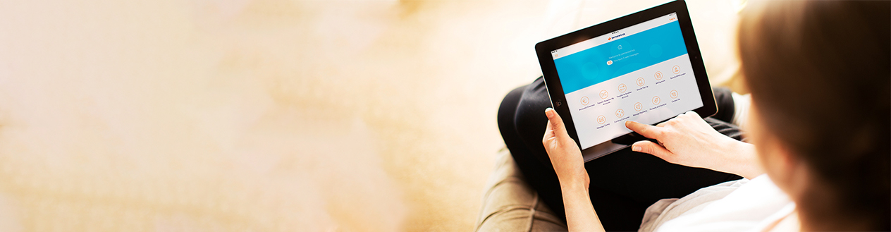 A woman scrolling on her tablet