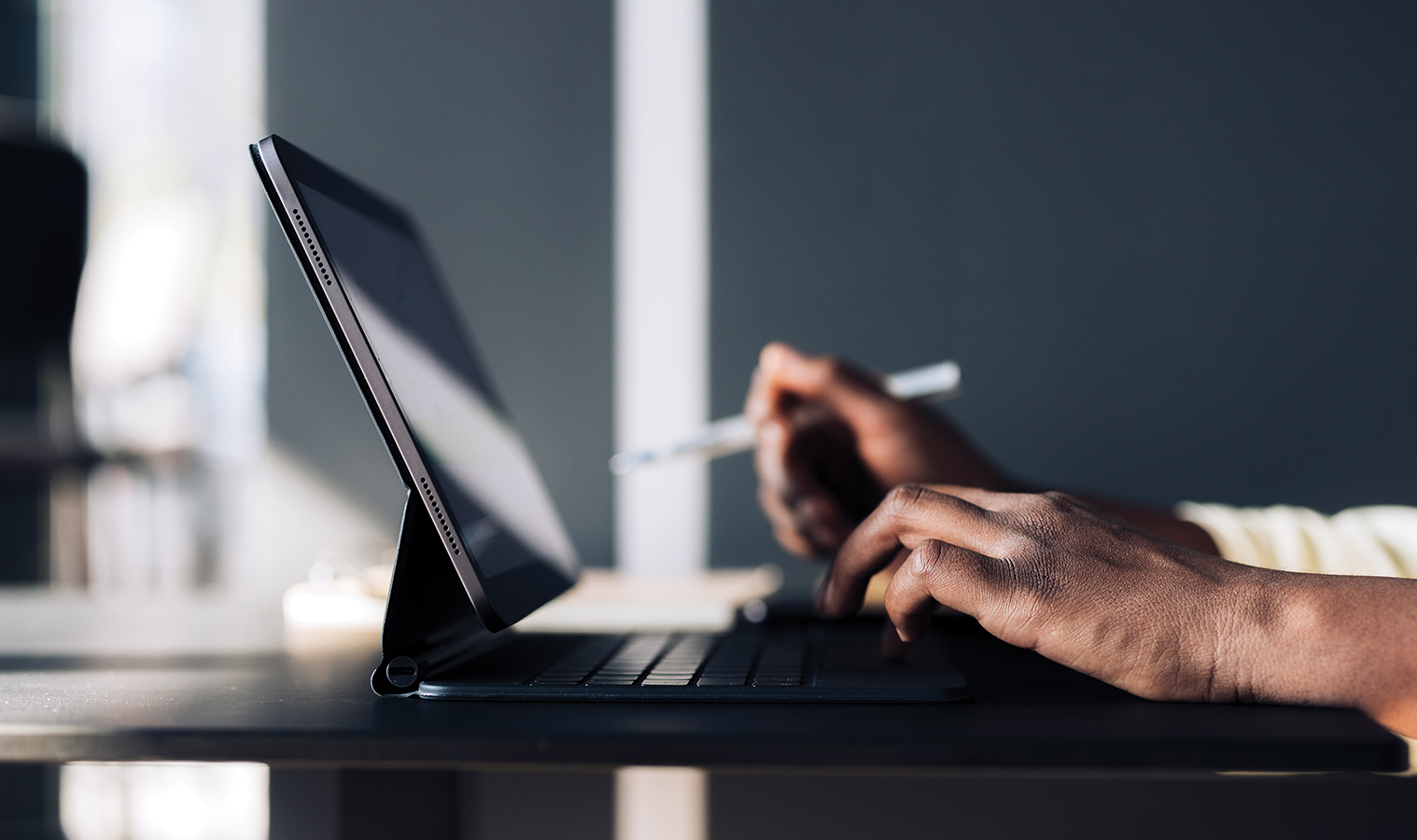 close up on hands typing on a laptop